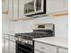 Stainless steel gas range with white tile backsplash at 1035 Bull Dog Ln, Wingate, NC 28174