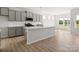 Modern kitchen featuring gray cabinets, quartz countertops, and stainless steel appliances at 1035 Bull Dog Ln, Wingate, NC 28174