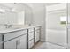 Double vanity bathroom with gray cabinets and view to bedroom at 1035 Bull Dog Ln, Wingate, NC 28174