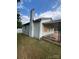 Side view of a small house with a chimney and boarded windows at 1900 Salome Church Rd, Charlotte, NC 28262