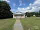 Small house with boarded windows, needing renovation at 1900 Salome Church Rd, Charlotte, NC 28262