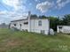 Back of house with visible utilities and storage shed at 1900 Salome Church Rd, Charlotte, NC 28262