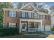 Brick two-story house with a front porch and a two-car garage at 1432 Bedlington Dr, Charlotte, NC 28269