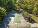 Outdoor bocce ball court with shaded pergola seating areas at 1432 Bedlington Dr, Charlotte, NC 28269