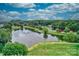 Serene community lake with fountain and lush landscaping at 1013 Taylor Glenn Ln, Indian Trail, NC 28079