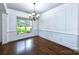 Formal dining room with hardwood floors and chandelier at 1013 Taylor Glenn Ln, Indian Trail, NC 28079