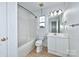 Updated bathroom with tub, shower, and vanity at 1013 Taylor Glenn Ln, Indian Trail, NC 28079