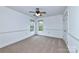 Spacious bedroom with neutral carpeting and ceiling fan at 1013 Taylor Glenn Ln, Indian Trail, NC 28079