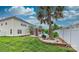 Landscaped backyard with a pool, palm trees, and firepit at 1013 Taylor Glenn Ln, Indian Trail, NC 28079