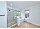 Clean bathroom features a shower/tub combo and large window at 1013 Taylor Glenn Ln, Indian Trail, NC 28079