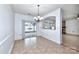 Casual dining area with tile floors and sliding glass doors to backyard at 1013 Taylor Glenn Ln, Indian Trail, NC 28079
