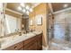 Well-appointed bathroom with granite vanity and a walk-in shower at 300 Eagle Bend Dr, Waxhaw, NC 28173