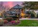 Stunning home with stone and brick exterior at sunset at 300 Eagle Bend Dr, Waxhaw, NC 28173