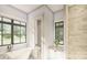 Spa-like bathroom with soaking tub, walk-in shower, and modern fixtures at 300 Spanish Oak Ln, Gastonia, NC 28056