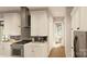 Modern kitchen with white cabinets, granite countertops, and stainless steel appliances at 300 Spanish Oak Ln, Gastonia, NC 28056