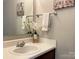 Clean bathroom with a single sink and decorative accents at 416 Galesburg Dr, Monroe, NC 28110