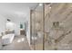 Luxurious bathroom with marble shower, soaking tub, and dual vanity at 1106 Anniston Pl # 51, Indian Trail, NC 28079