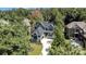 Aerial view of two story house with driveway and surrounding homes at 1106 Anniston Pl # 51, Indian Trail, NC 28079