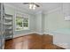 Bright office with hardwood floors, built-in shelving and large window at 7230 Timber Ridge Dr, Mint Hill, NC 28227