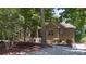 Brick house with a welcoming front porch and landscaped yard at 7230 Timber Ridge Dr, Mint Hill, NC 28227