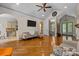 Open living space with hardwood floors, comfortable seating and access to kitchen at 7230 Timber Ridge Dr, Mint Hill, NC 28227