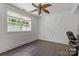 Bright home office features wood floors, large window, and stylish wall design at 7230 Timber Ridge Dr, Mint Hill, NC 28227