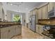 Eat-in kitchen with stainless steel appliances and lots of cabinet storage at 7230 Timber Ridge Dr, Mint Hill, NC 28227