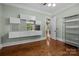 Office with hardwood floors, built-in shelving and window at 7230 Timber Ridge Dr, Mint Hill, NC 28227