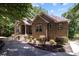 Brick home with stone accents, double door entry, and landscaping at 7230 Timber Ridge Dr, Mint Hill, NC 28227