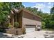 Two-car garage with attached storage space and driveway at 7230 Timber Ridge Dr, Mint Hill, NC 28227