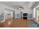 Finished basement with hardwood floors and views into kitchen at 7230 Timber Ridge Dr, Mint Hill, NC 28227