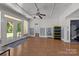 Spacious basement with hardwood floors, french doors, and laundry area at 7230 Timber Ridge Dr, Mint Hill, NC 28227