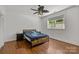 Cozy bedroom with hardwood floors and ceiling fan at 7230 Timber Ridge Dr, Mint Hill, NC 28227