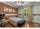 Bedroom with hardwood floors, large window and decorative wall at 7230 Timber Ridge Dr, Mint Hill, NC 28227