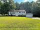 Front view of a ranch house with a spacious lawn at 622 Sharon Dr, Statesville, NC 28265