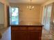 Kitchen island with granite countertop and wood cabinets at 622 Sharon Dr, Statesville, NC 28265