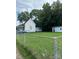 Side yard view of house with chain link fence and detached shed at 505 Cemetary St, Salisbury, NC 28144