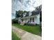White house with front porch, side yard and driveway at 505 Cemetary St, Salisbury, NC 28144