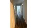 Hallway with dark laminate floors and neutral walls at 505 Cemetary St, Salisbury, NC 28144