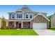 Two-story house with stone accents and a landscaped lawn at 249 Winford Rd, Troutman, NC 28116