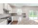 Modern kitchen with granite island and stainless steel appliances at 249 Winford Rd, Troutman, NC 28116