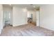 Upstairs hallway with carpet and access to bedrooms at 249 Winford Rd, Troutman, NC 28116