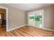 Well-lit bedroom with hardwood floors and access to backyard at 1158 Evans Ave, Rock Hill, SC 29732