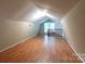 Bright bonus room featuring laminate floors and a window at 1158 Evans Ave, Rock Hill, SC 29732