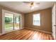 Bright bedroom with hardwood floors and sliding glass door to patio at 1158 Evans Ave, Rock Hill, SC 29732