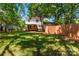 Spacious backyard with lush green grass and mature trees at 1158 Evans Ave, Rock Hill, SC 29732