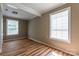 Light and airy bedroom with hardwood floors and two windows at 1158 Evans Ave, Rock Hill, SC 29732
