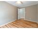 Charming bedroom with hardwood floors and access to another room at 1158 Evans Ave, Rock Hill, SC 29732