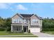 Two story home with gray siding and a two car garage at 203 Coronado Ave # 55, Matthews, NC 28104