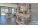 Bright entryway with a stylish console table and mirror at 219 Coronado Ave # 59, Matthews, NC 28104